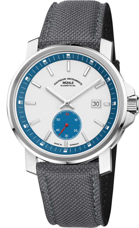 Frontalansicht der Armbanduhr 29er Big Kleine Sekunde mit weißem Zifferblatt, petrolfarbenem Hilfszifferblatt und Rehaut im silbernen Gehäuse am grauen Canvasband.